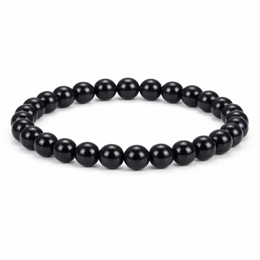 Natural black obsidian crystal bracelet in a close white-background bead view