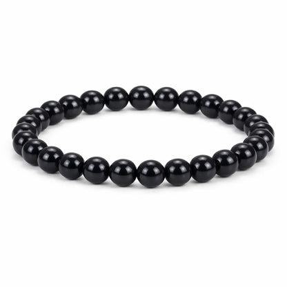Natural black obsidian crystal bracelet in a close white-background bead view