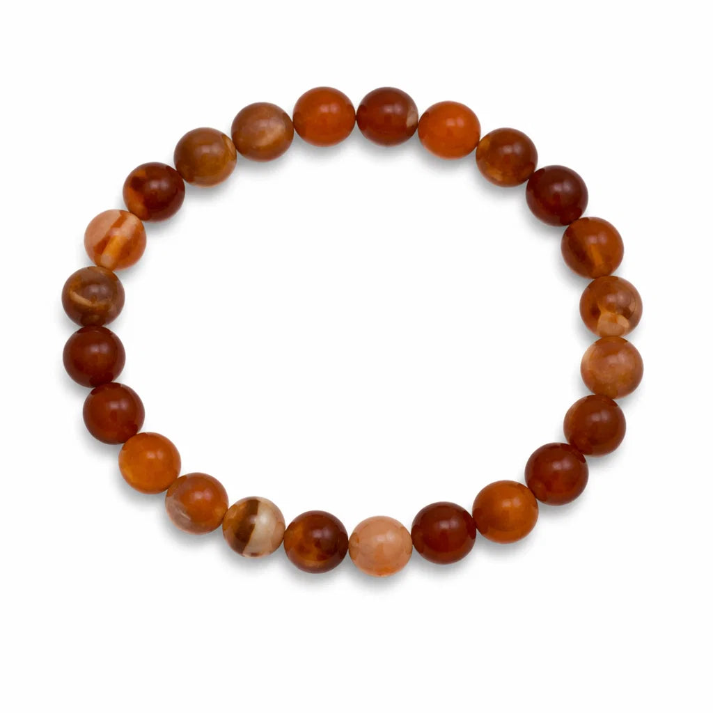 Natural carnelian crystal bracelet showing the bead colour and surface on white