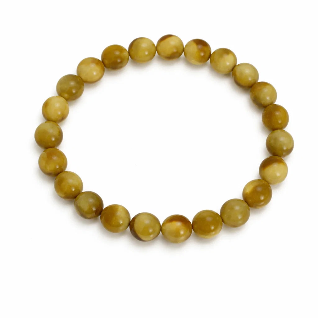 Natural cat's eye crystal bracelet showing the bead colour and surface on white