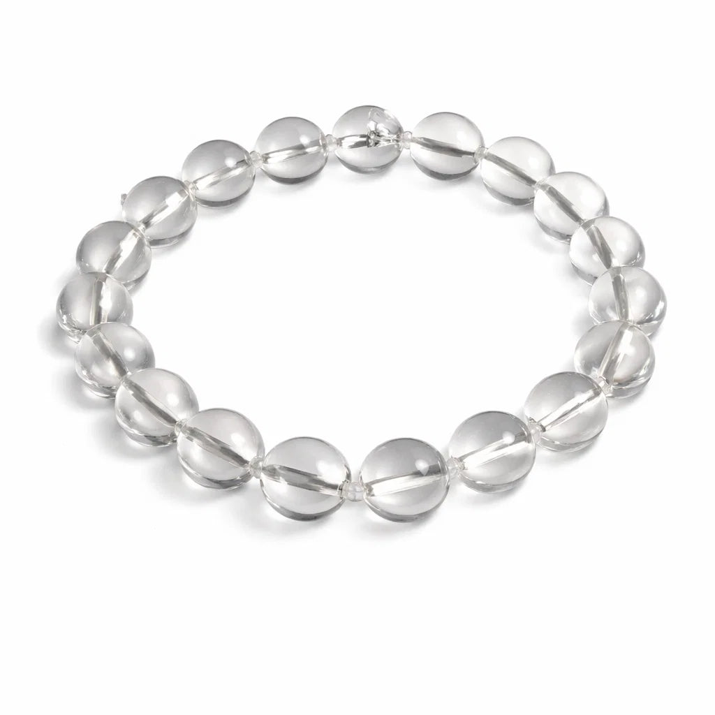 Natural clear quartz crystal bracelet– Vastu remedy in a close white-background bead view