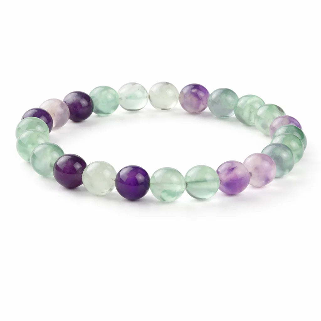 Natural fluorite crystal bracelet with round beads on a clean white background
