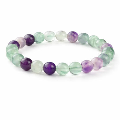Natural fluorite crystal bracelet with round beads on a clean white background