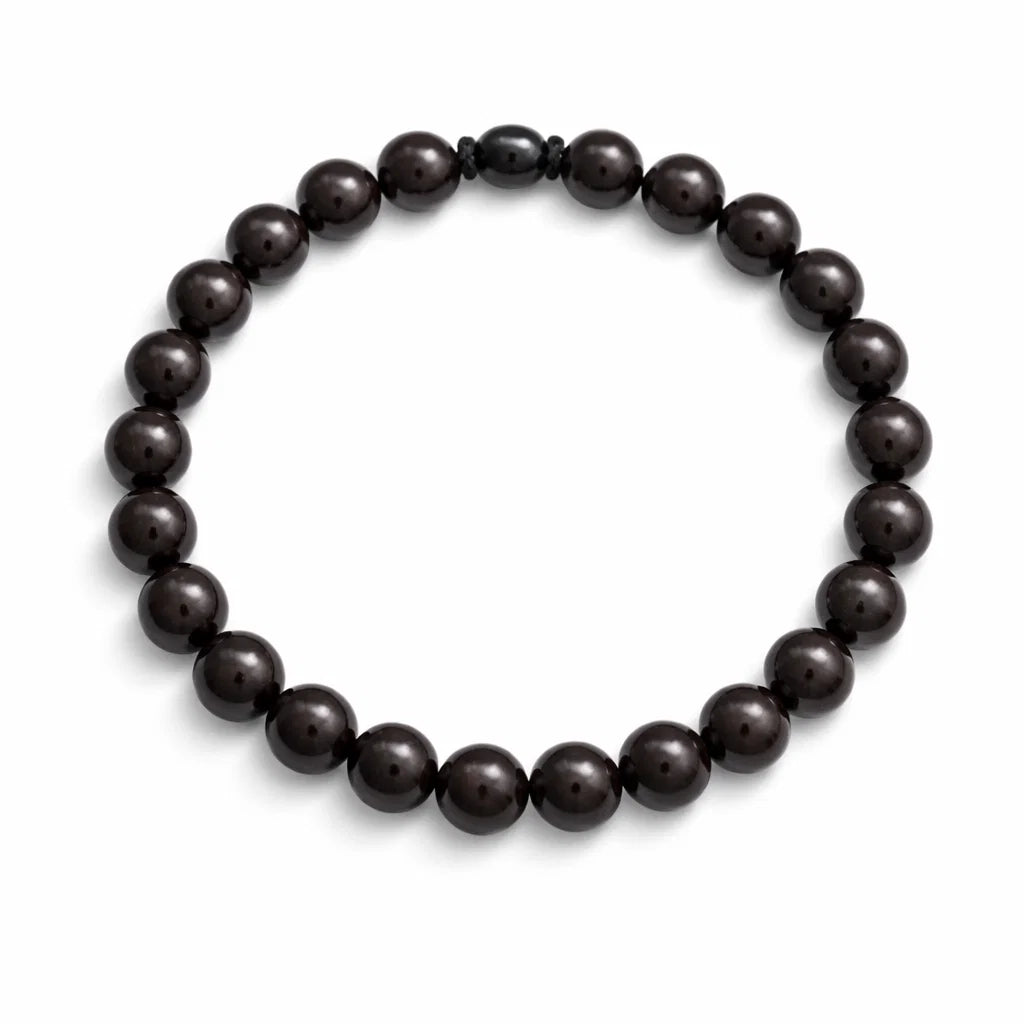 Natural garnet crystal bracelet showing the bead colour and surface on white