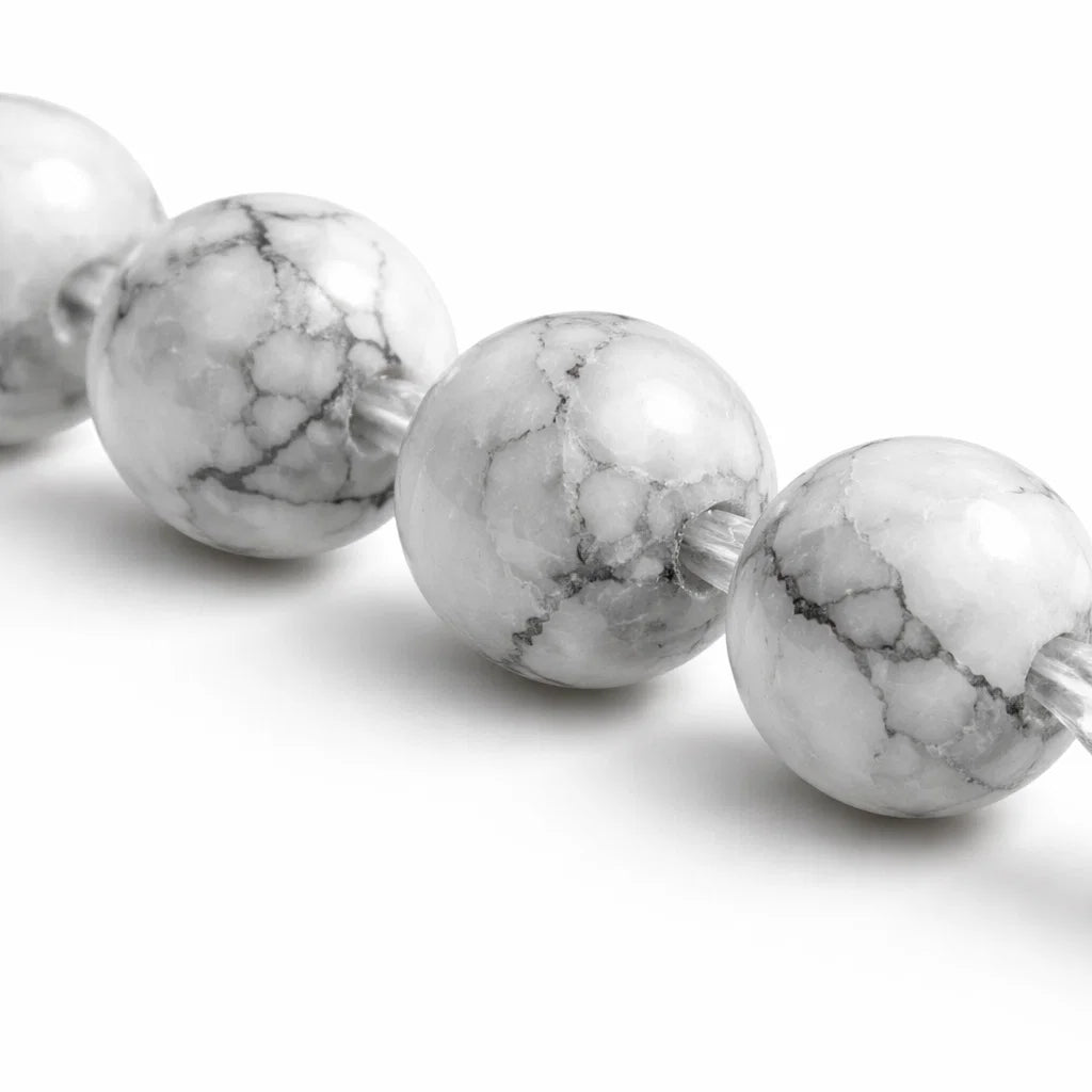 Natural howlite crystal bracelet with round beads on a clean white background