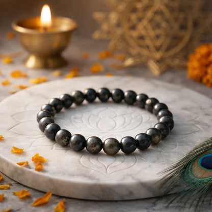 Golden sheen obsidian crystal bracelet shown in a second hand-held product view