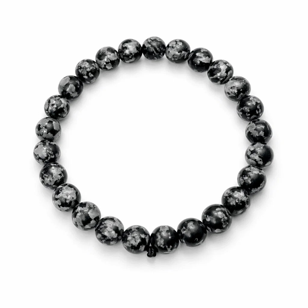 Natural snowflake obsidian crystal bracelet with round beads on a clean white background