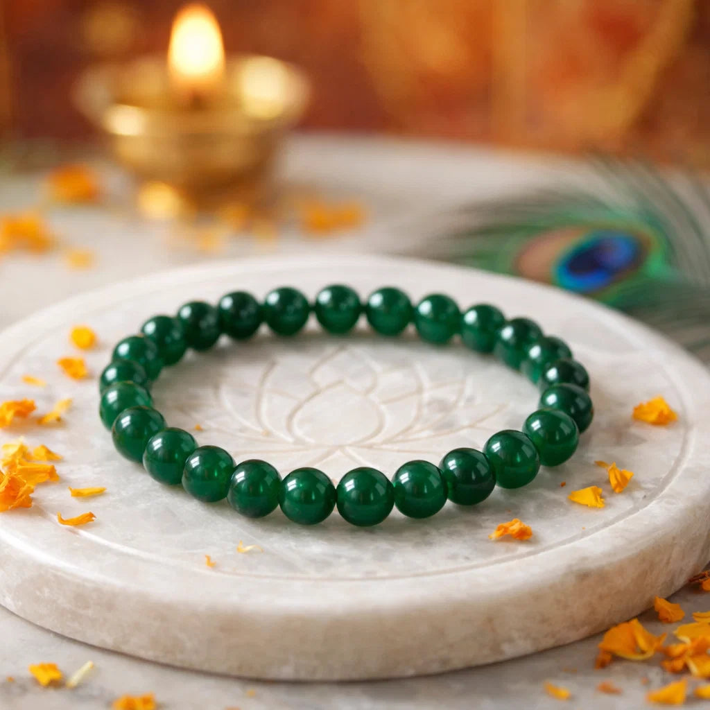 Natural green jade crystal bracelet shown in a second hand-held product view