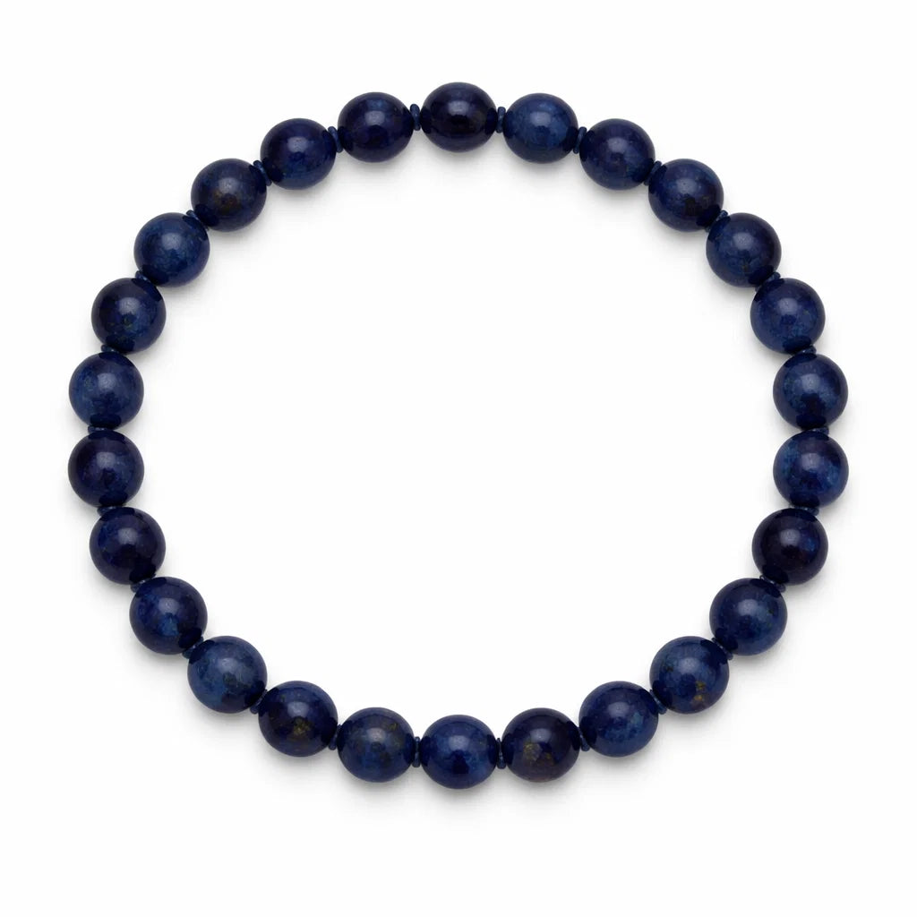 Natural lapis lazuli crystal mala showing the bead colour and surface on white