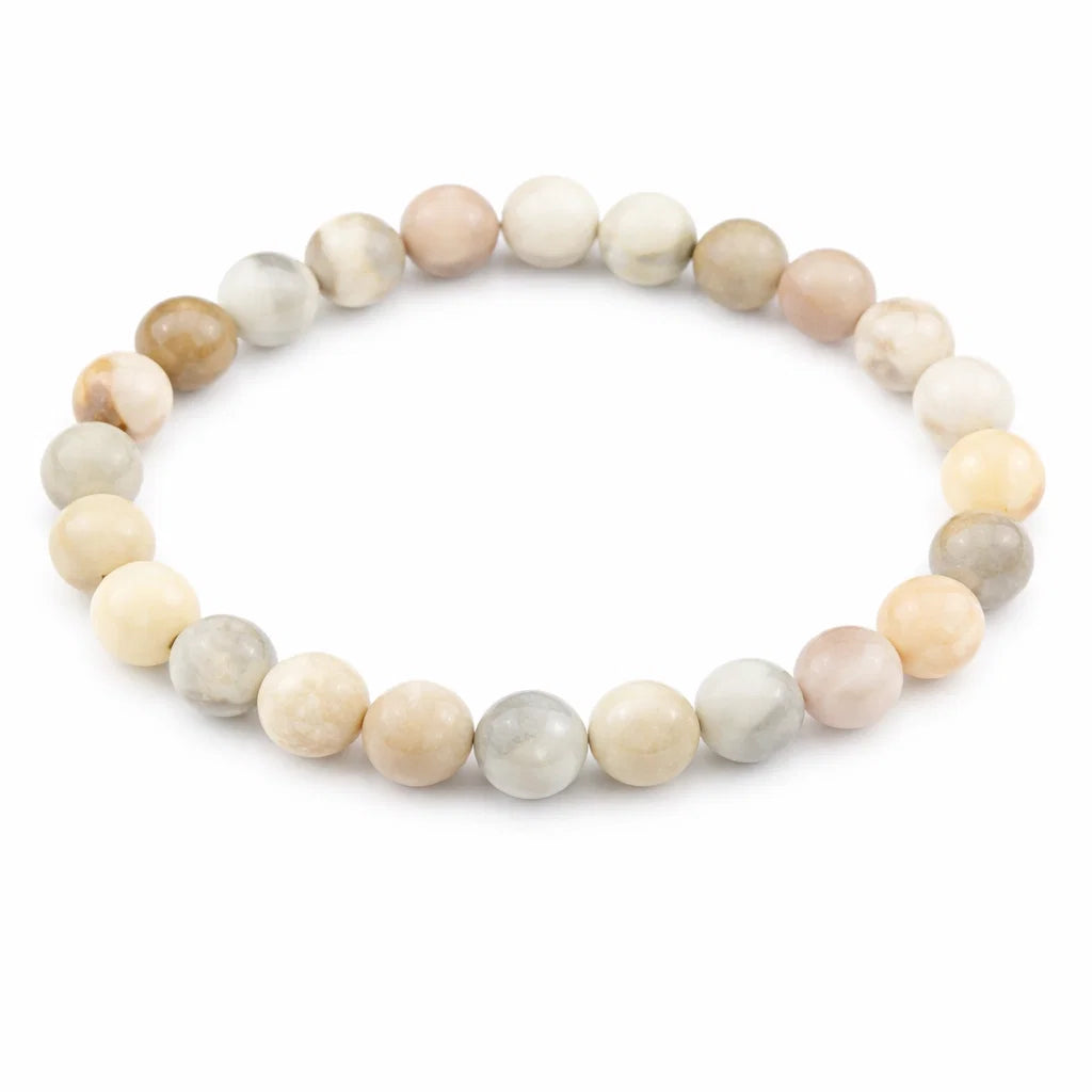Natural multi moonstone crystal bracelet showing the bead colour and surface on white