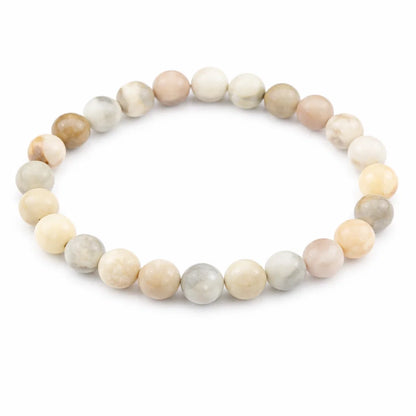 Natural multi moonstone crystal bracelet showing the bead colour and surface on white