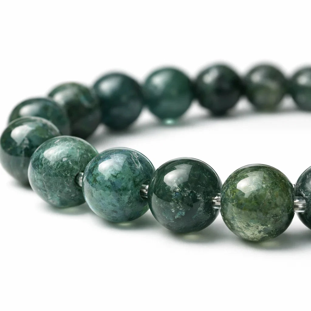 Natural moss agate crystal bracelet in a close white-background bead view