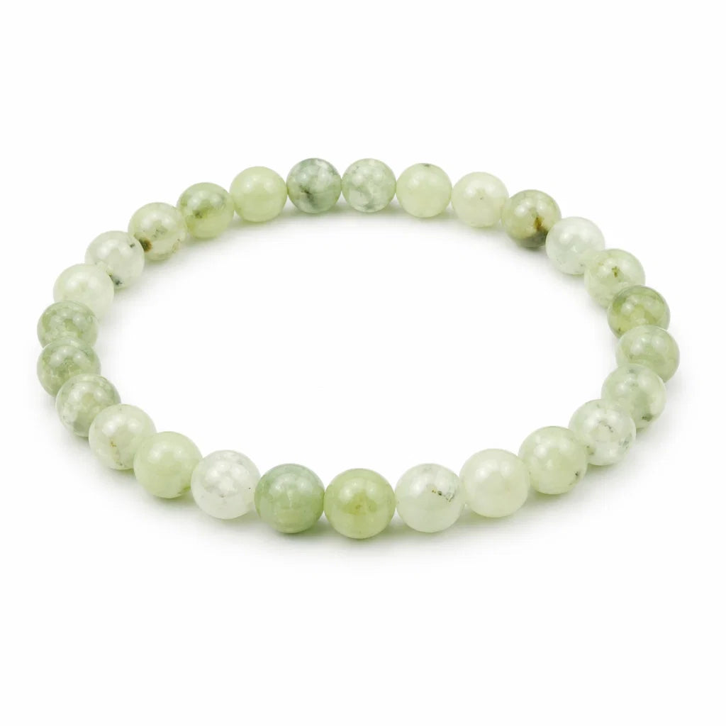 Natural prehnite crystal bracelet showing the bead colour and surface on white