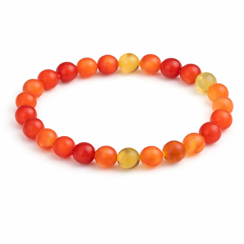 Natural red agate crystal bracelet showing the bead colour and surface on white