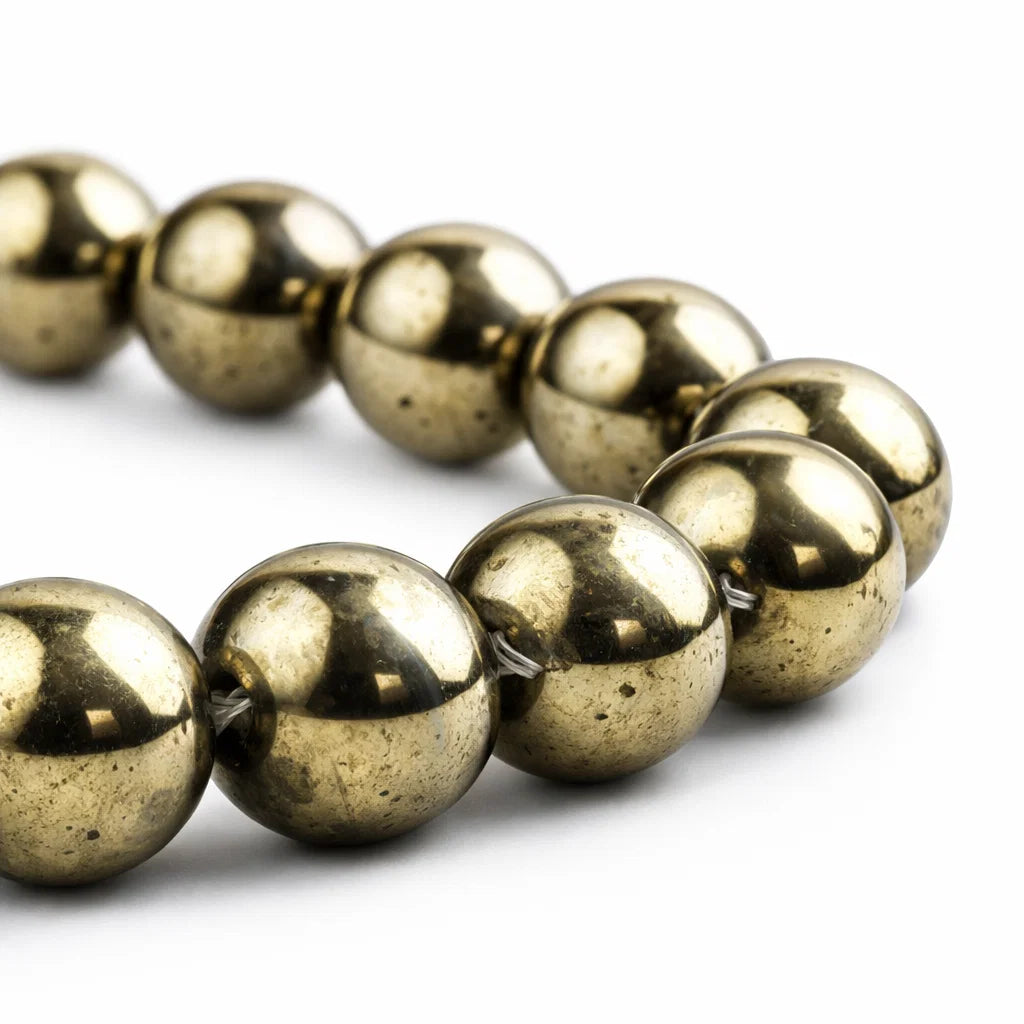 Golden pyrite 8mm beads closeup polish sparkle Vastu remedy bracelet pyrite crystal texture

