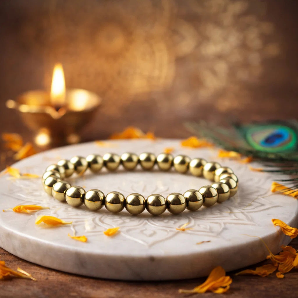 Golden pyrite bead bracelet, Vastu remedy shown in a second hand-held product view
