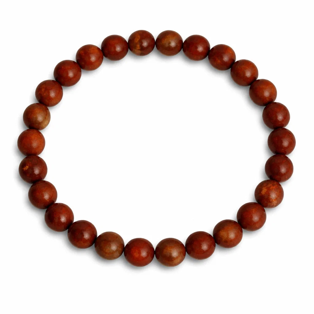 Natural red jasper crystal bracelet in a close white-background bead view