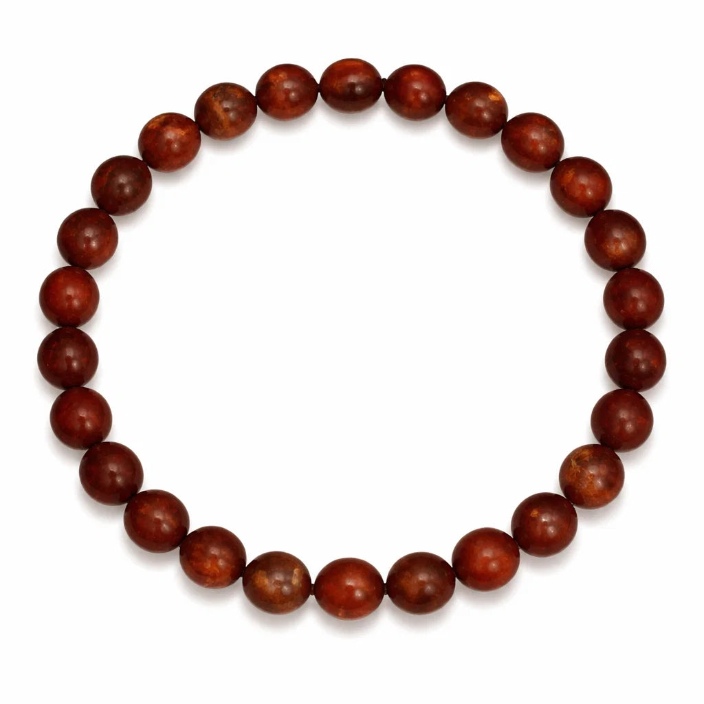 Natural red jasper crystal bracelet with round beads on a clean white background