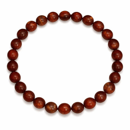 Natural red jasper crystal bracelet with round beads on a clean white background