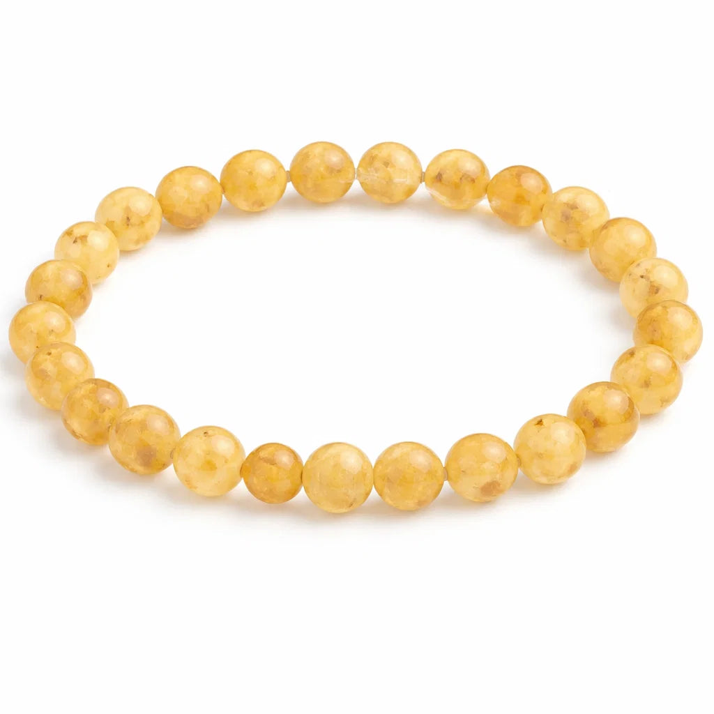 Natural rutile quartz crystal bracelet in a close white-background bead view