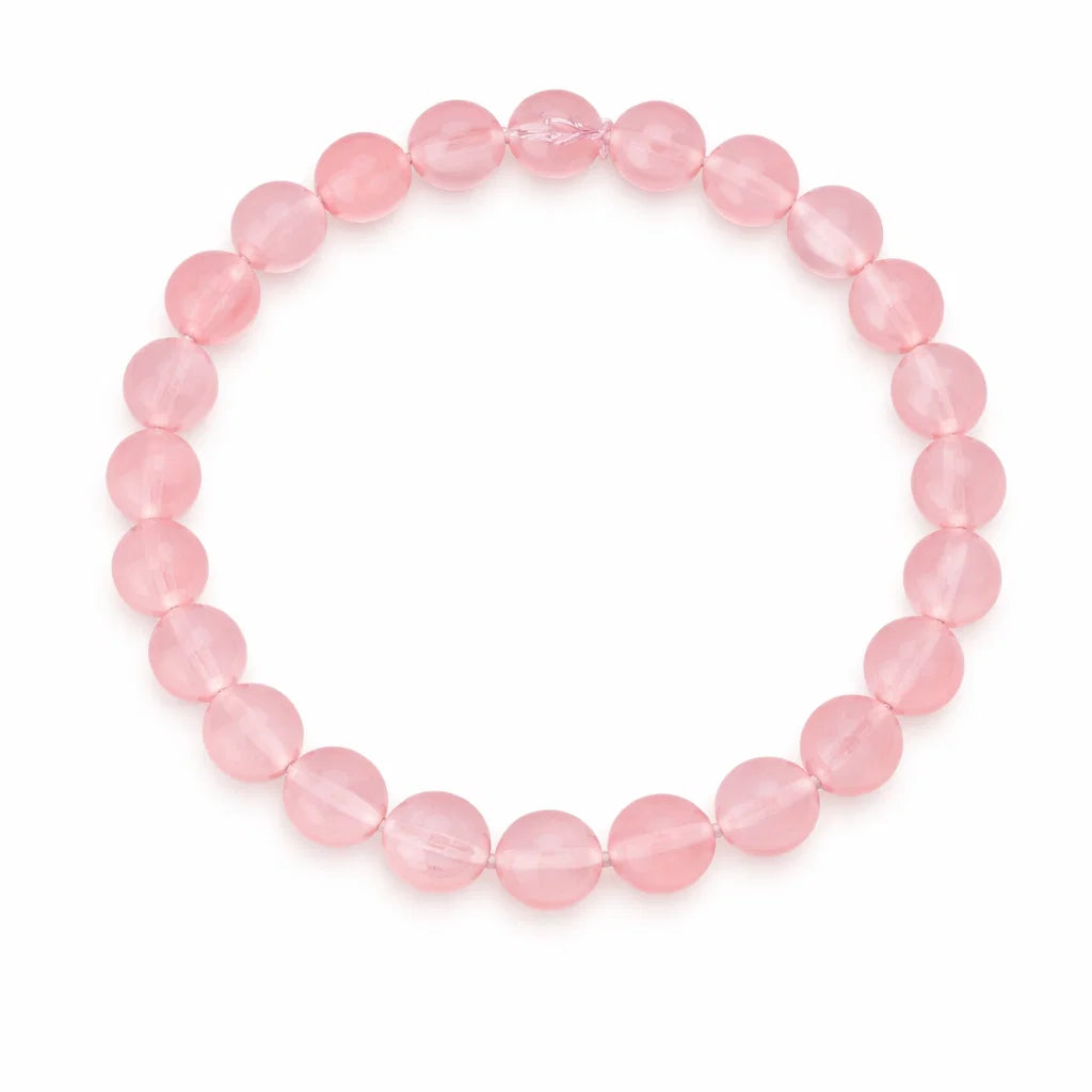 Natural rose quartz crystal bracelet shown in a separate hand-held product photograph