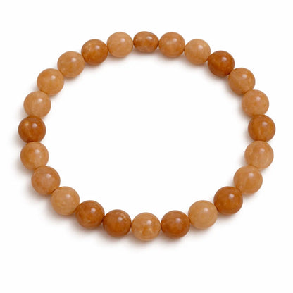 Natural sunstone crystal bracelet shown in a separate hand-held product photograph