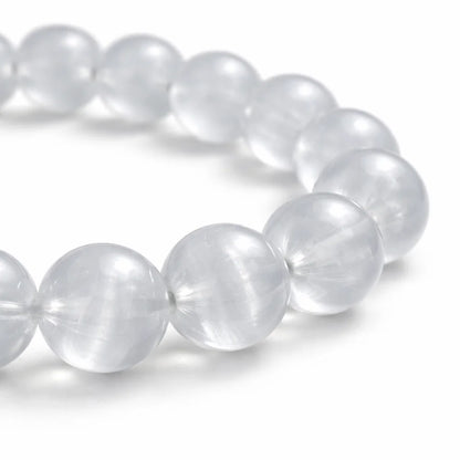 Natural selenite crystal bracelet with round beads on a clean white background
