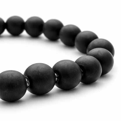 Natural shaligram crystal bracelet showing the bead colour and surface on white