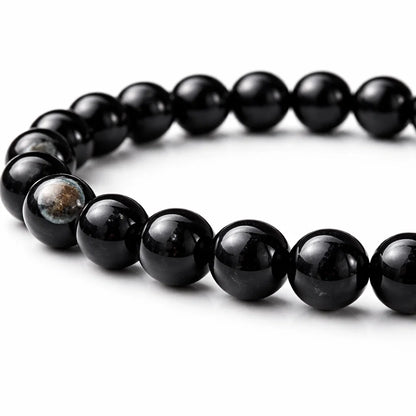 Natural sulemani hakik crystal bracelet in a close white-background bead view