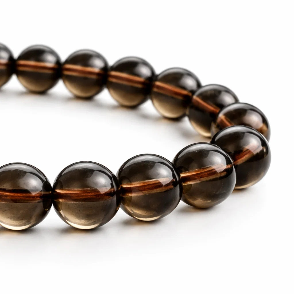 Natural smoky quartz crystal mala with round beads on a clean white background