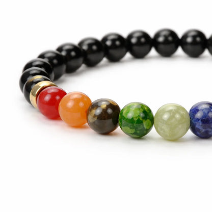 7 chakra lava crystal bracelet with round beads on a clean white background