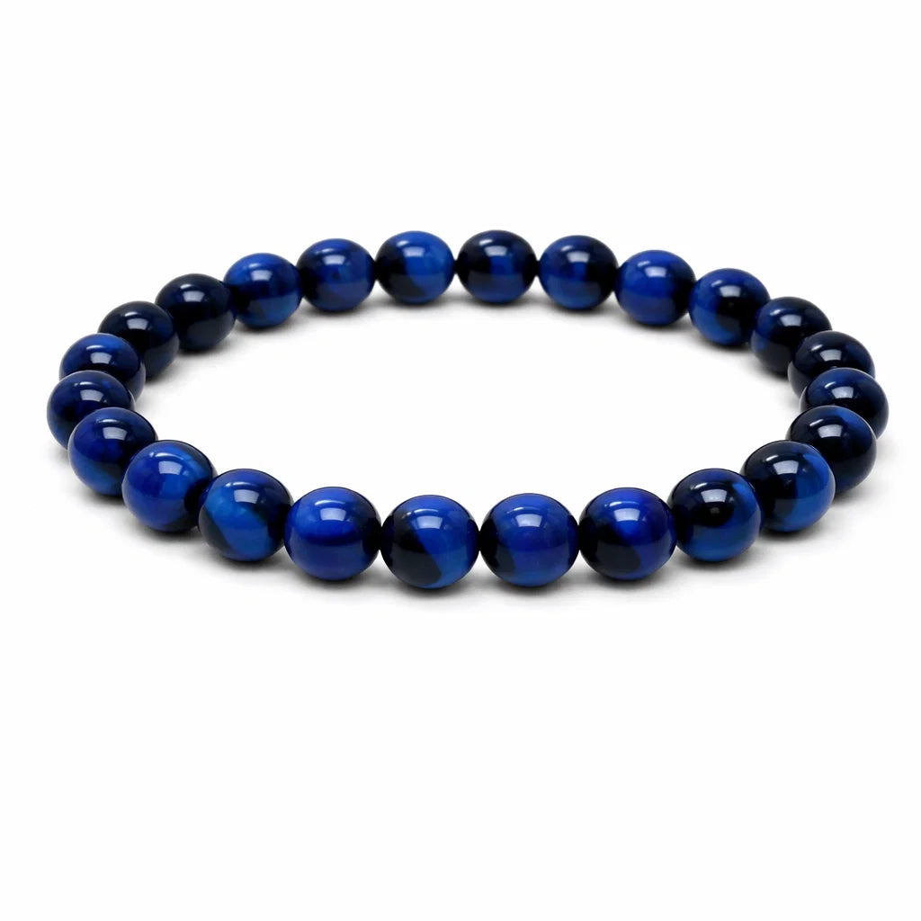 Natural blue tiger eye crystal bracelet showing the bead colour and surface on white