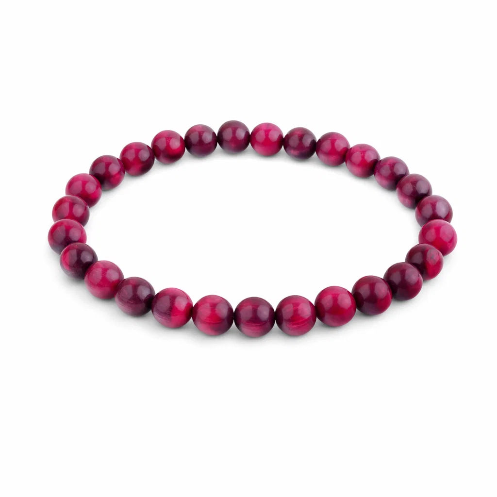 Natural pink tiger eye crystal bracelet centred in a clean product photograph