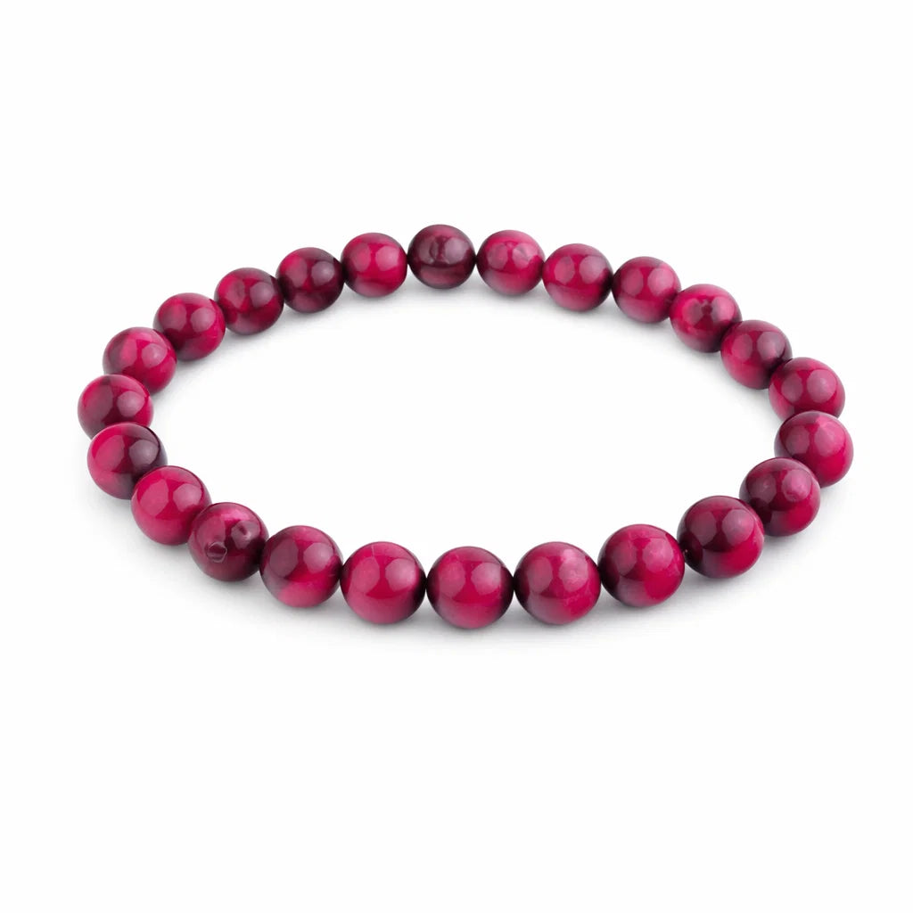 Natural pink tiger eye crystal bracelet showing the bead colour and surface on white