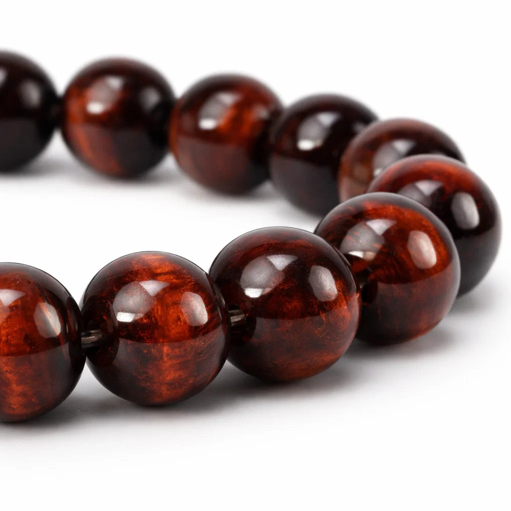 Natural red tiger eye crystal bracelet with round beads on a clean white background