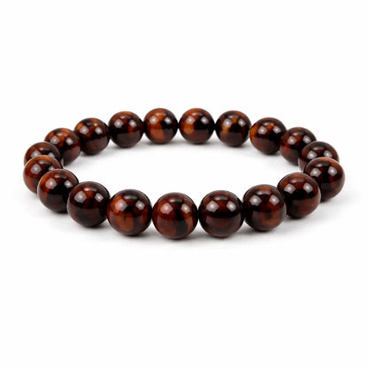 Natural red tiger eye crystal bracelet showing the bead colour and surface on white