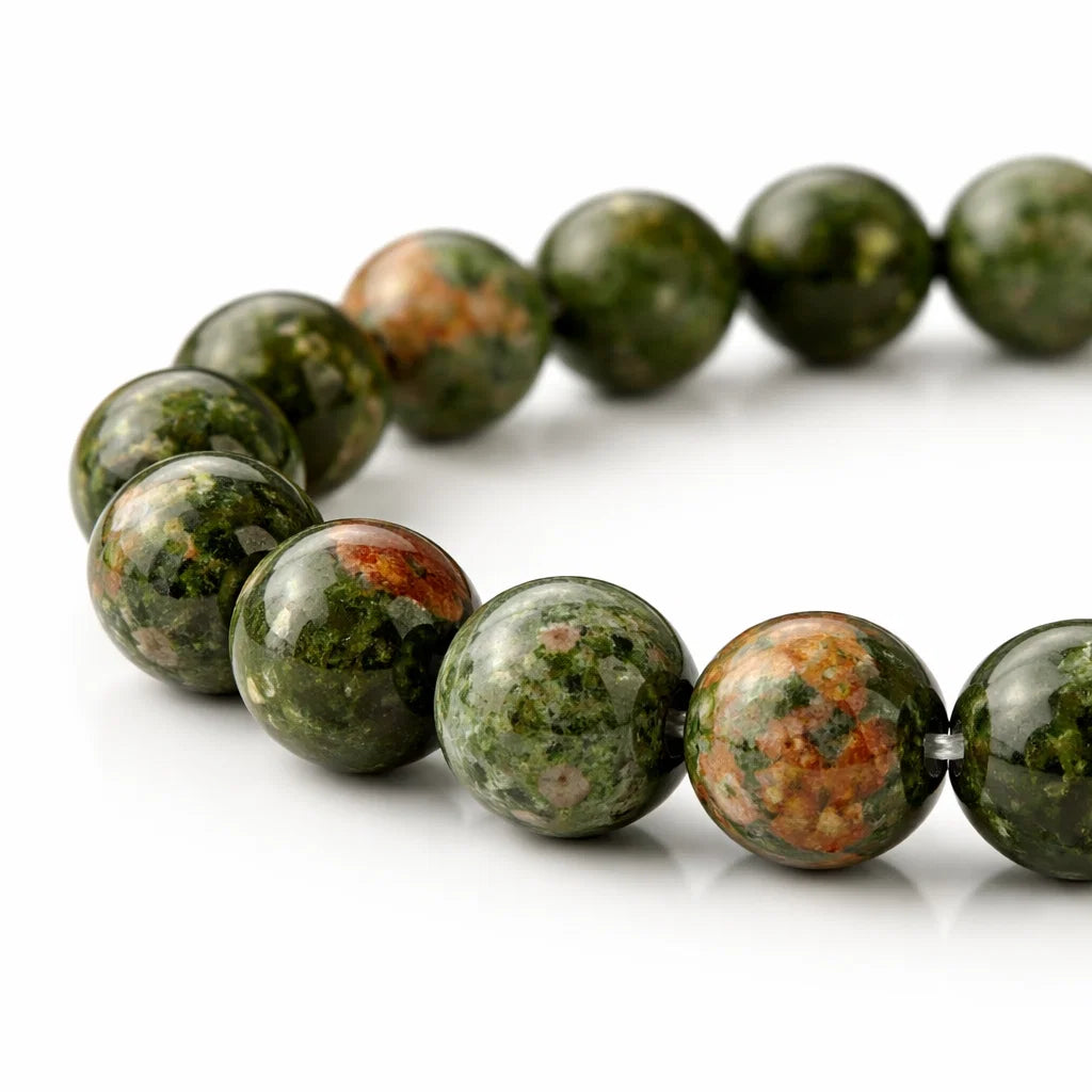 Natural unakite crystal bracelet in a close white-background bead view