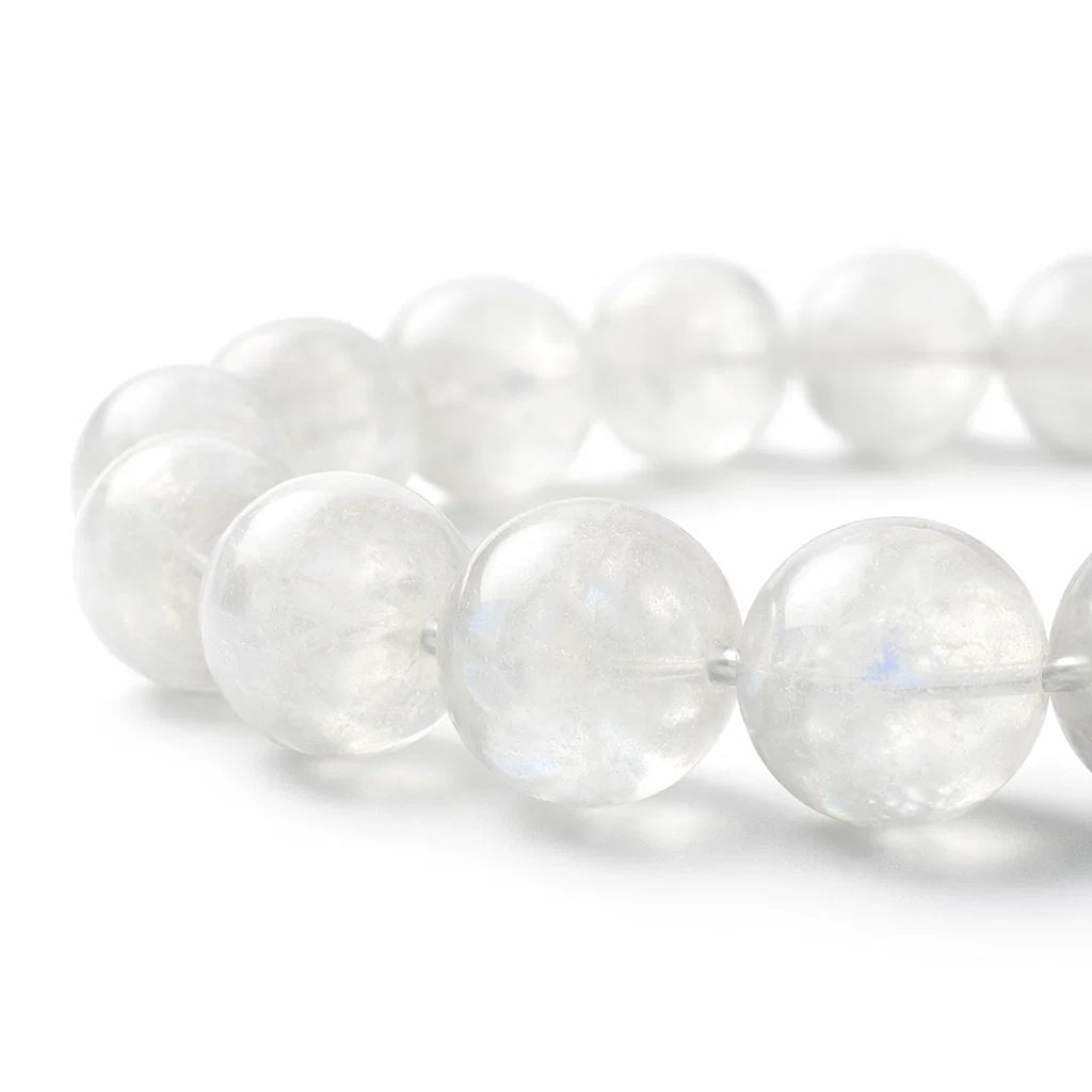 Natural rainbow moonstone crystal bracelet with round beads on a clean white background