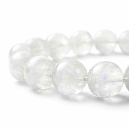 Natural rainbow moonstone crystal bracelet with round beads on a clean white background