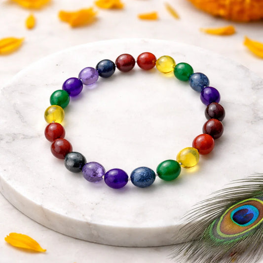 Multicolor agate crystal bracelet shown with a hand in a lifestyle photograph