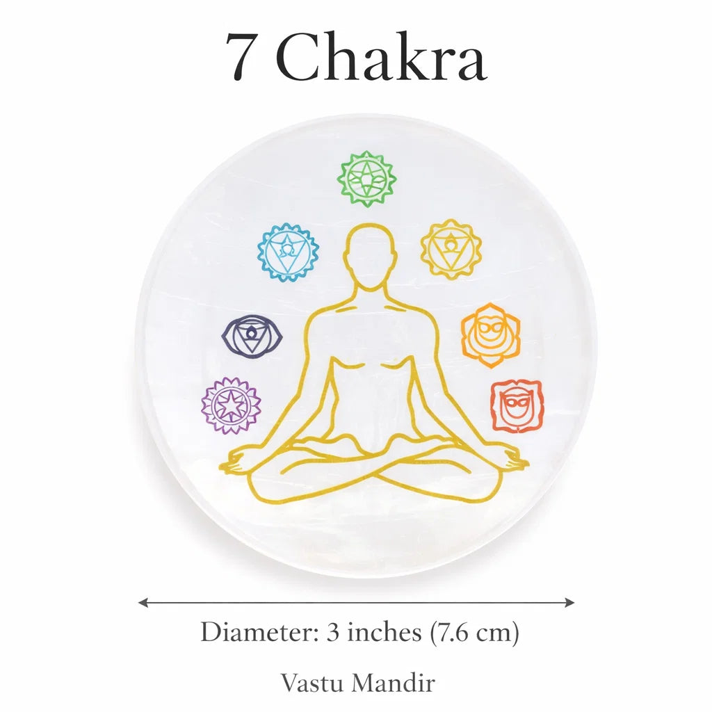 Seven chakra selenite plate displayed in a calm meditation setting
