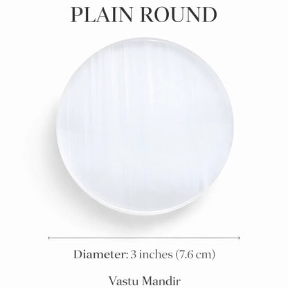 Plain round selenite plate on a clean white background