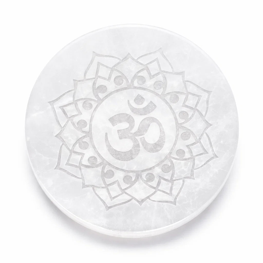 Om symbol selenite plate in a close product view on white