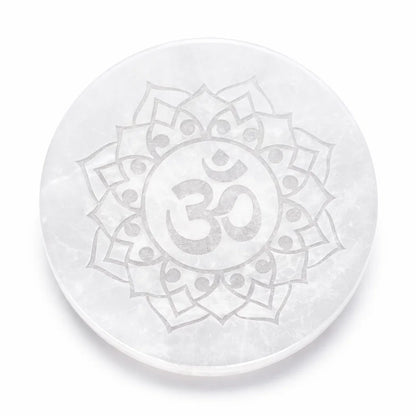Om symbol selenite plate in a close product view on white