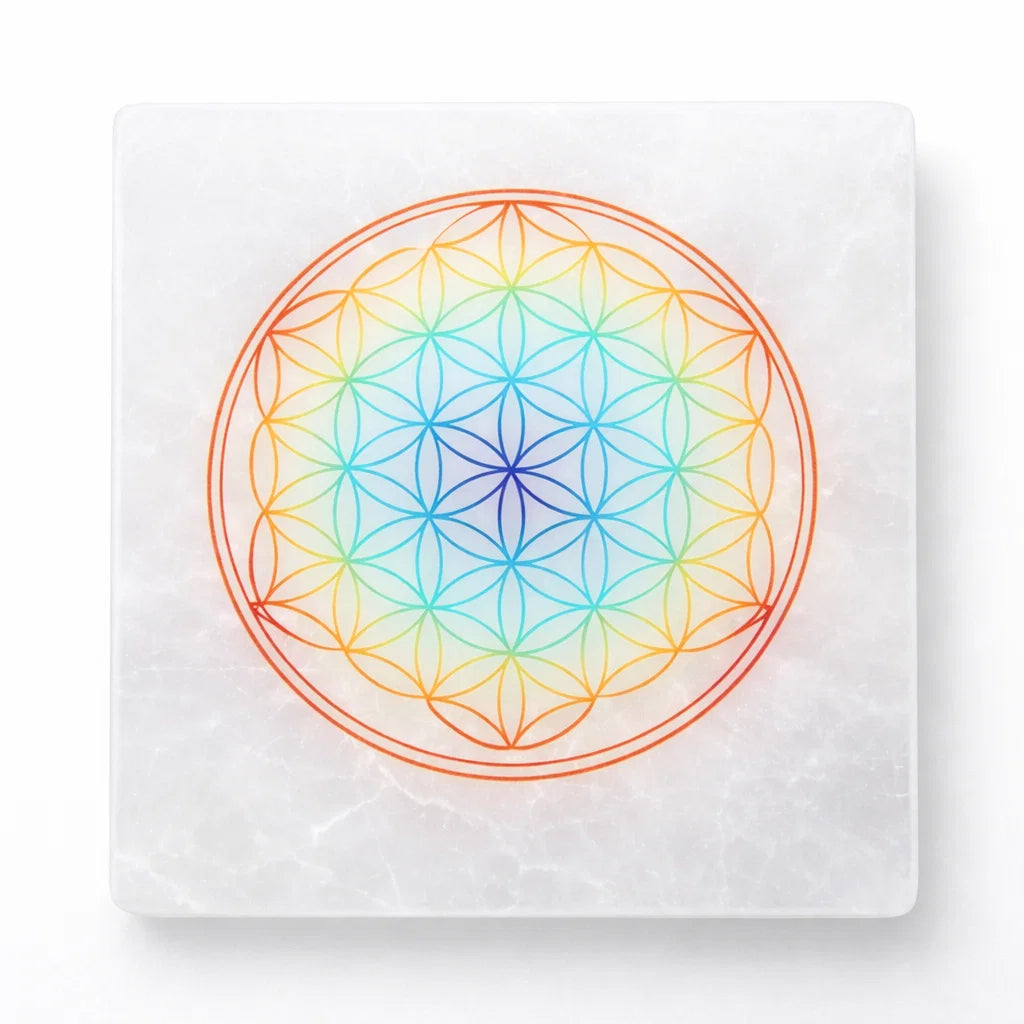 Mandala selenite plate in a close-up view against a clean white background