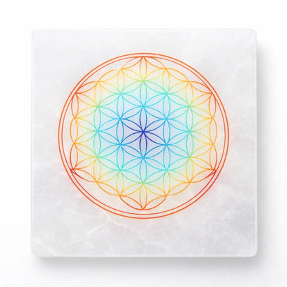 Mandala selenite plate in a close-up view against a clean white background