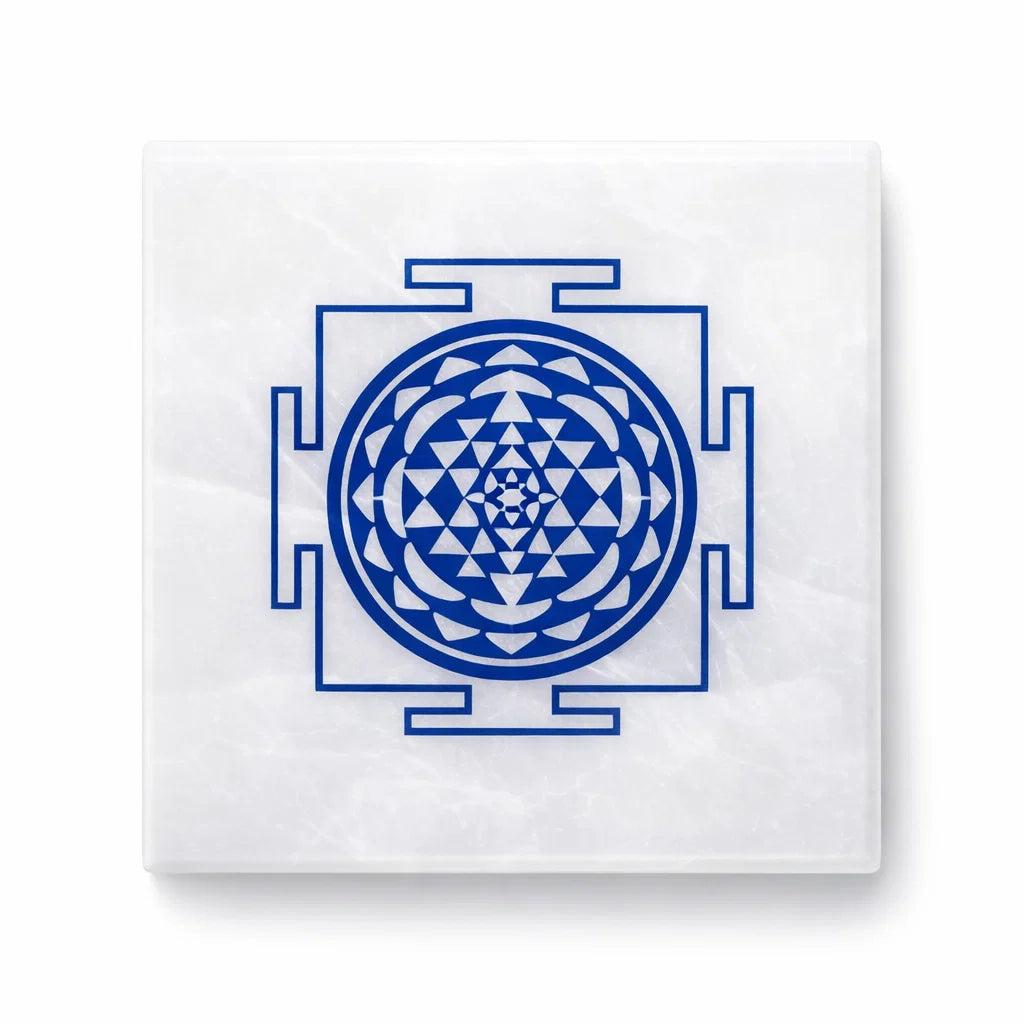 Shree yantra selenite plate on a clean white background