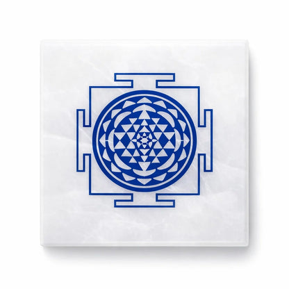 Shree yantra selenite plate on a clean white background