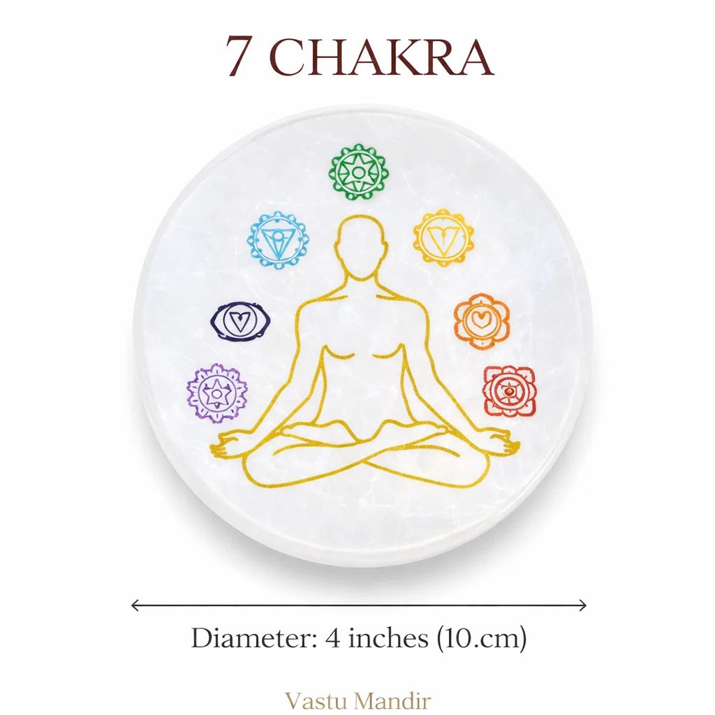 Round 7 chakra selenite plate on a clean white background