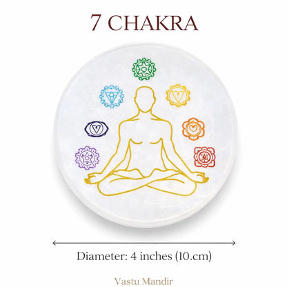 Round 7 chakra selenite plate on a clean white background